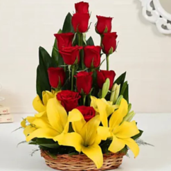 charming lilies and red roses basket with fast delivery options