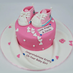 sweet pink baby girl reveal cake for celebration