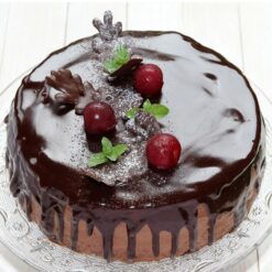 Frosty Chocolate Christmas Cake with winter-themed decorations, showcasing a festive and rich chocolate design.