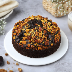 golden pineapple holiday cake decorated with festive toppings