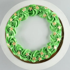 golden pineapple holiday cake decorated with festive toppings