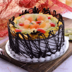 Fresh Fruit Cake with Whipped Cream and Colorful Fruits
