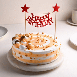 Golden Butterscotch Birthday Cake with crunchy layers and crown topper