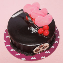 Luscious Cocoa Dream Cake topped with chocolate drizzle and decorations
