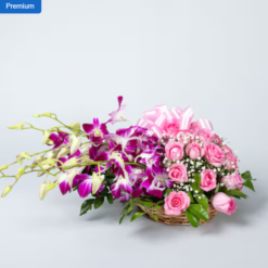 Elegant pink mixed flower basket with fresh roses and seasonal flowers