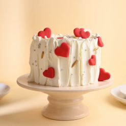 little heart red velvet cake with cream frosting