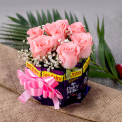 Pink roses and chocolate bouquet with fresh roses