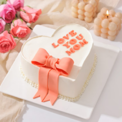 Heartfelt Mother’s Day bow cake with elegant cream design for mom